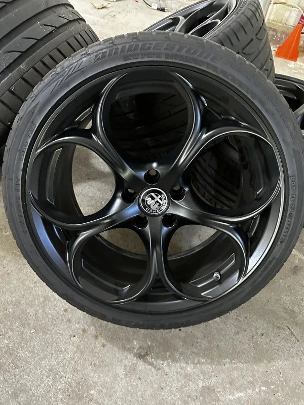 Black QV 5 holes with Potenza S-04 tires and wheels