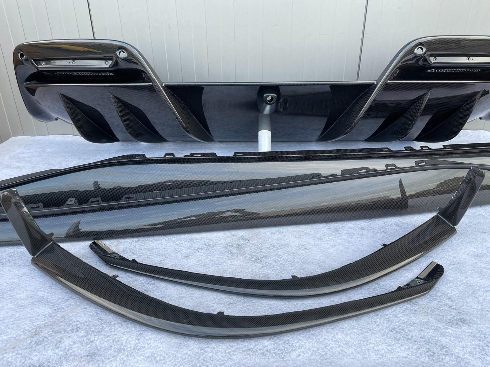 Ferrari 296 OEM carbon fiber parts in stock ready to go : Diffuser, side skirts, front lips