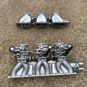 Three S.U. Carburetors and Intake Manifolds for Jaguar590
